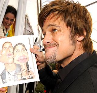 Brad Pitt is holding Brangelina picture